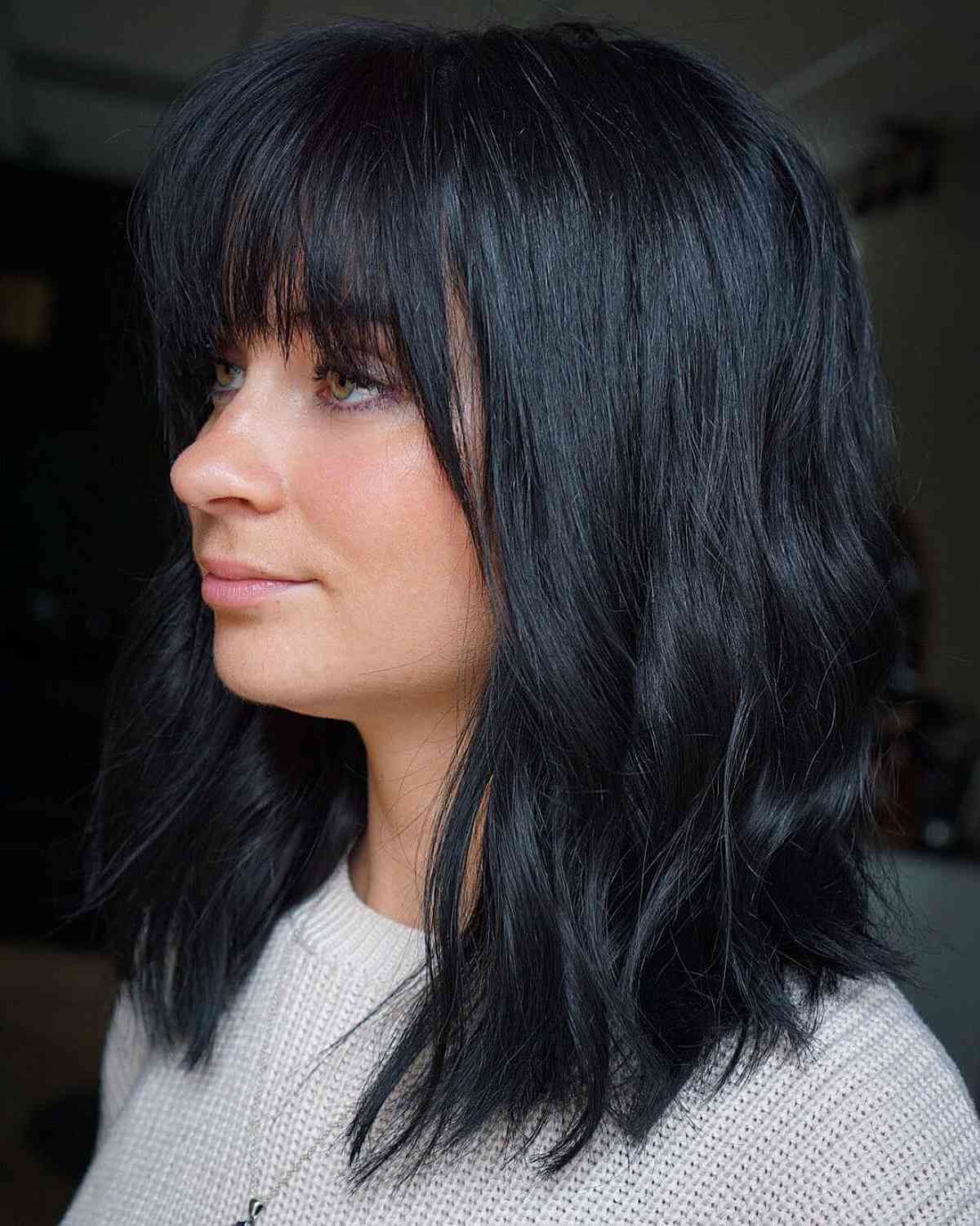 Textured bangs and layers shoulder-length