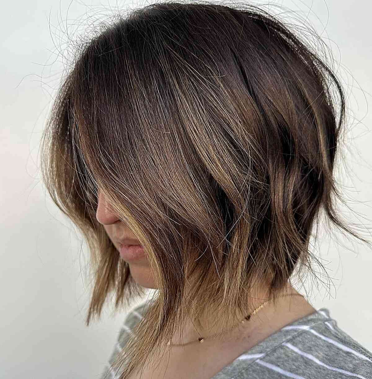 Textured Bob Cut with Golden Highlighted Tones