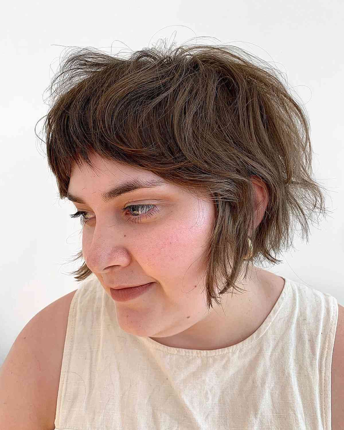 Textured Jaw-Length Bob with Shag Layers and Fringed Bangs
