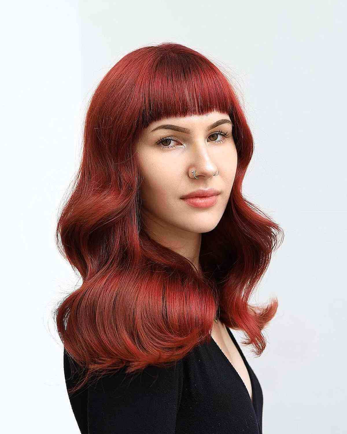 Textured Crimson Tresses with Straight Bangs