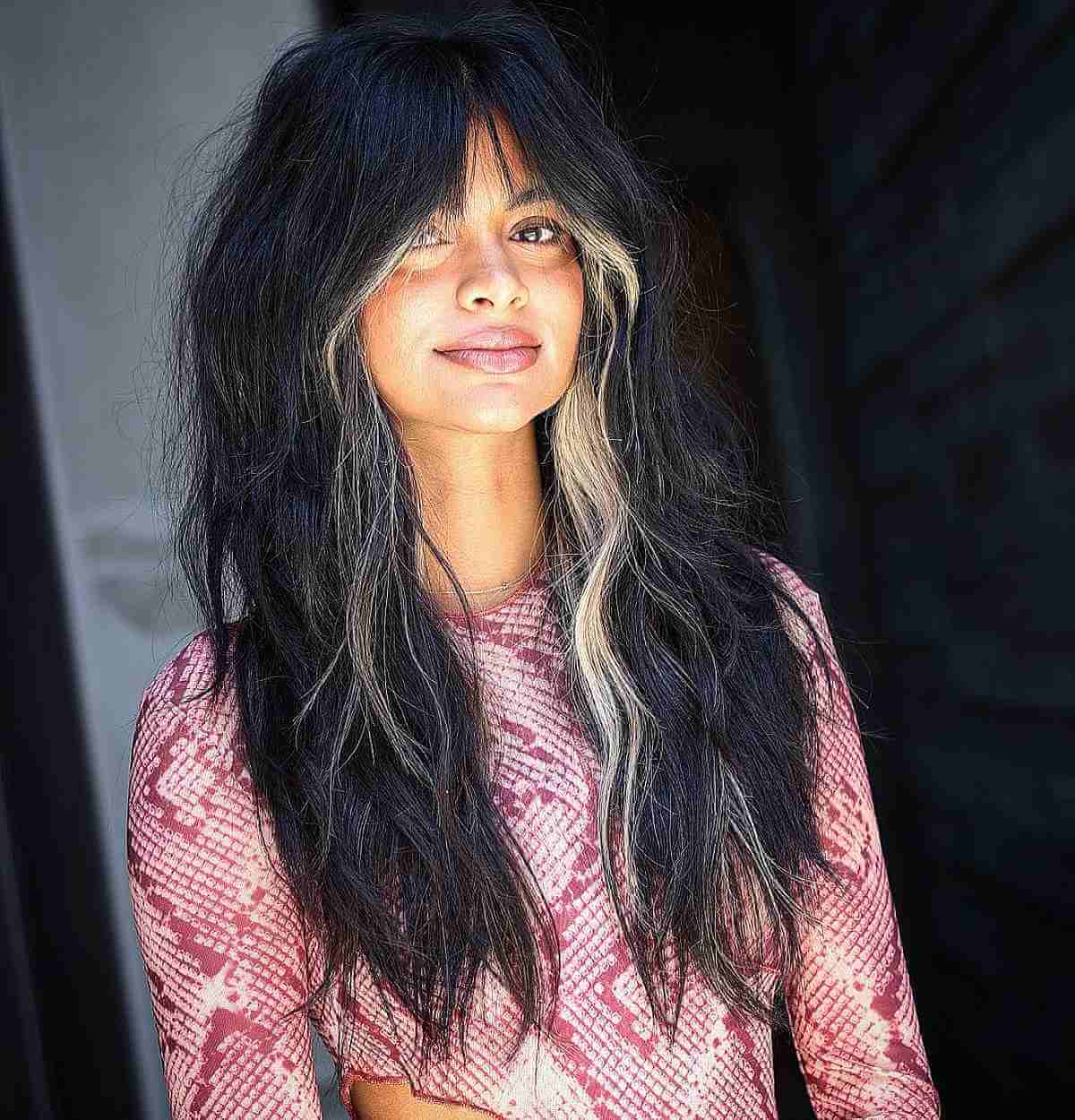 Long Textured Dark Black Hair Featuring a Blonde Money Piece