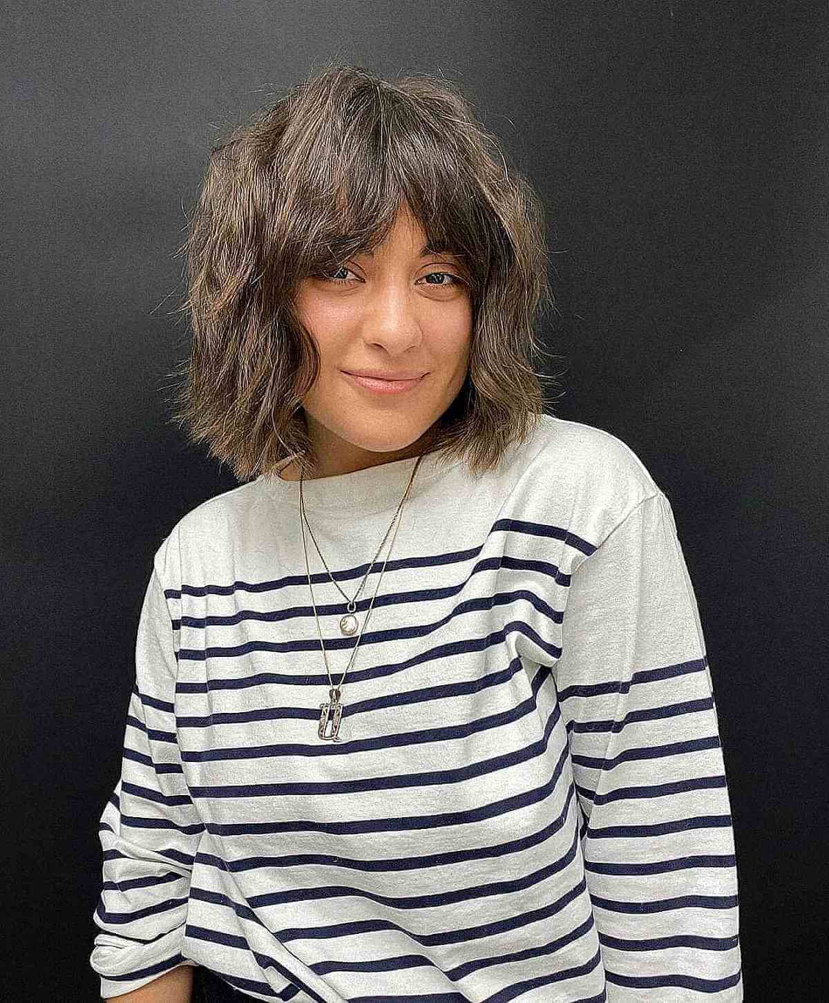 Textured Haircut with Center Part Bangs