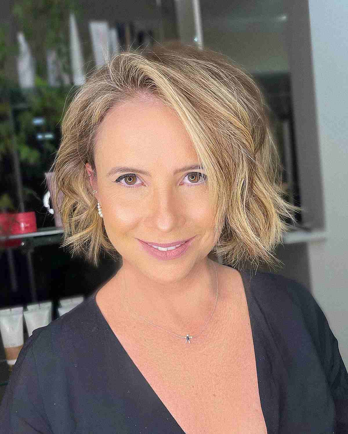 Chin-Length Textured Layered Bob Cut with a Bold Side Part