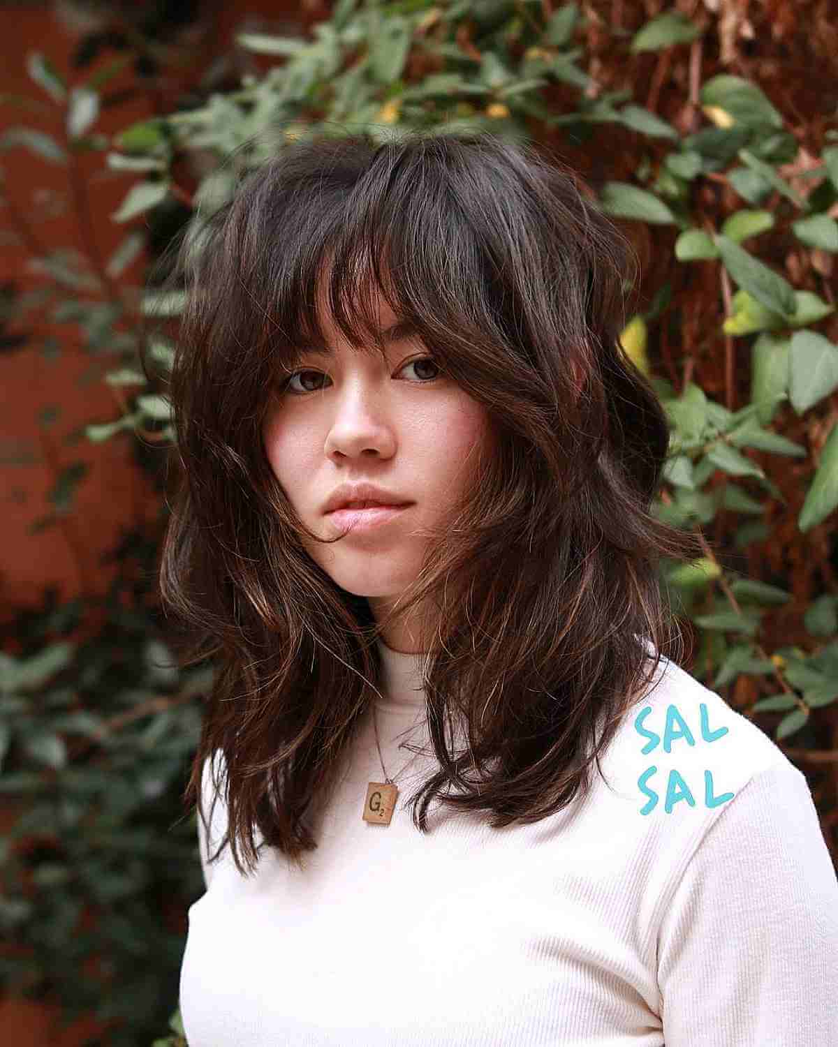 Medium Layered Shaggy Cut with a Face Frame and Bangs