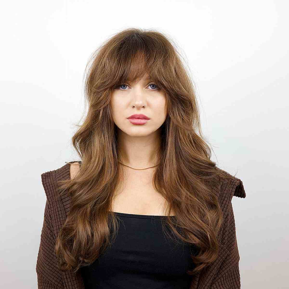 Textured Layered Hair with Bold Bangs