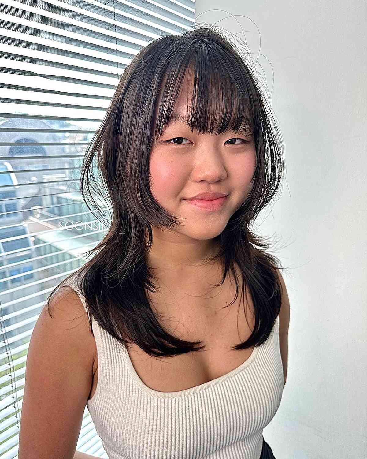 Medium Wolf Layered Haircut with Straight Bangs and Face Frame