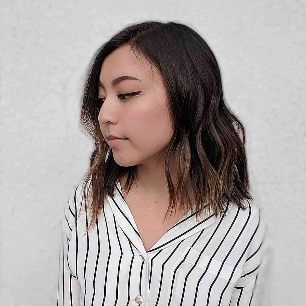 Textured Lob Haircut with Asymmetrical Waves for Round Faces
