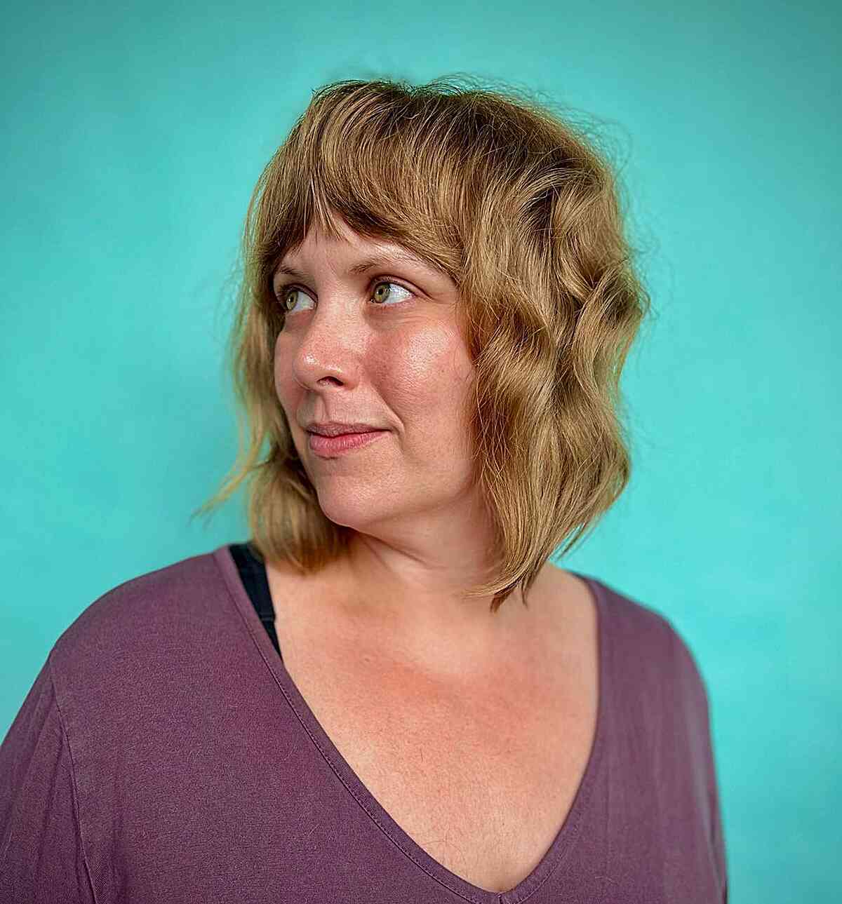 Textured Long Bob with Bold Bangs on Women Aged Forty