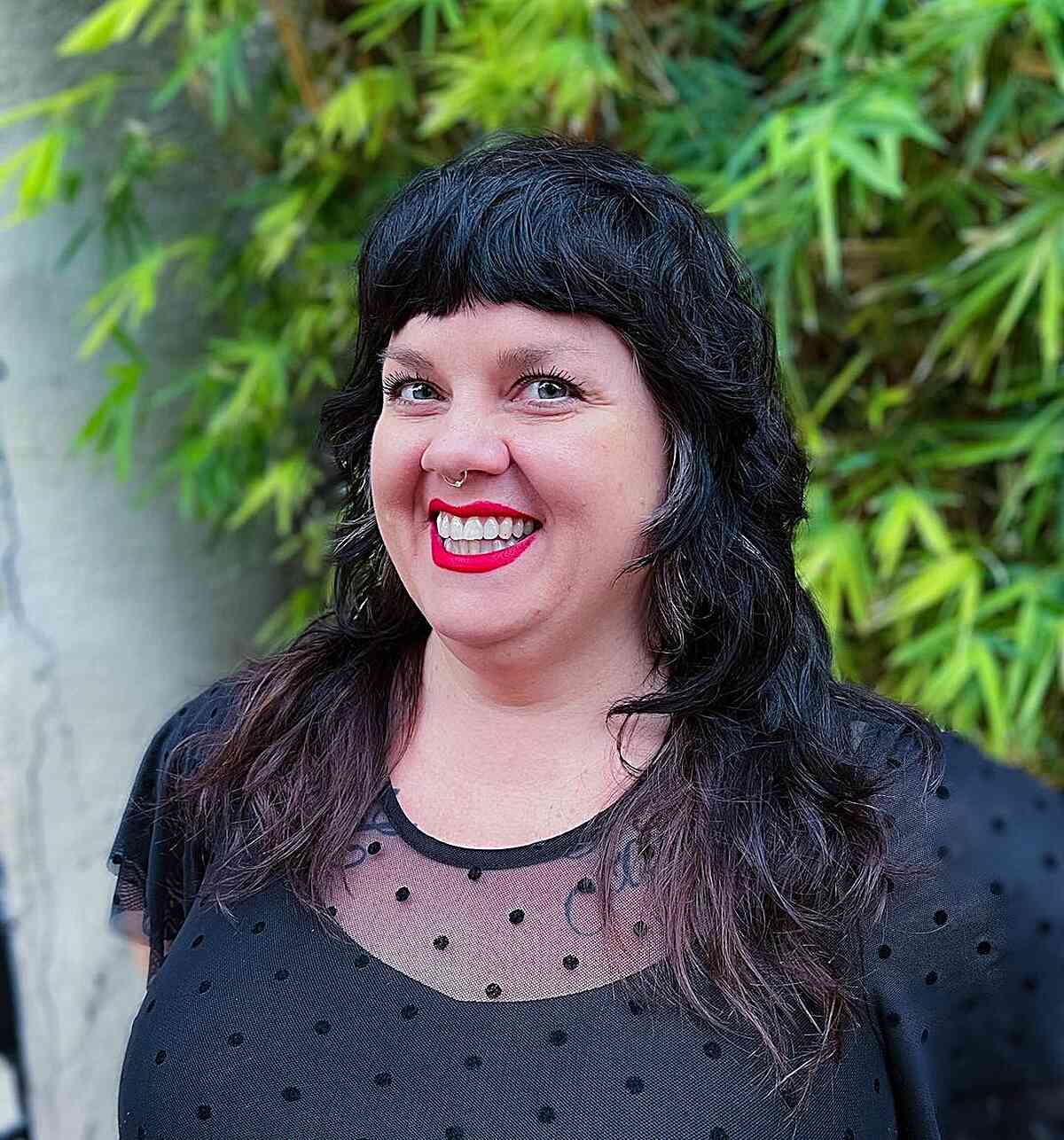 Textured Long Shag Hairstyle with Full Rounded Bangs for Fat Faces