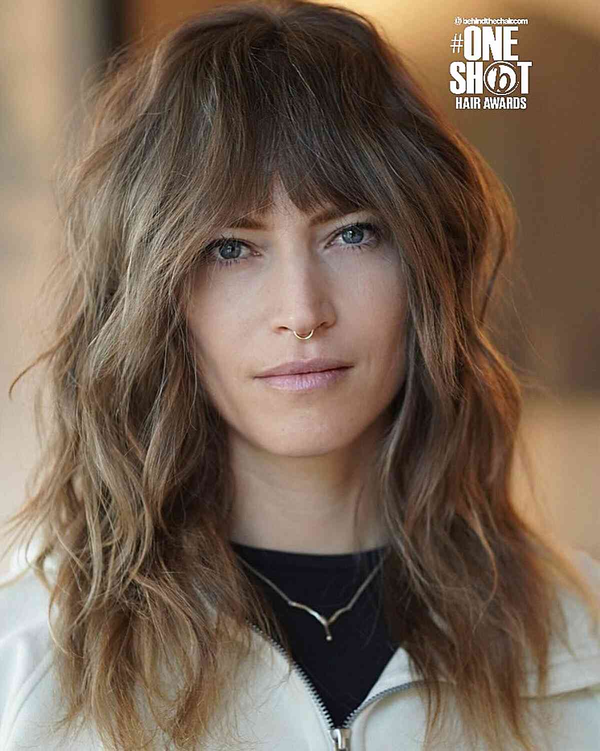 Textured Medium Wavy Cut with Playful Layers and Bangs