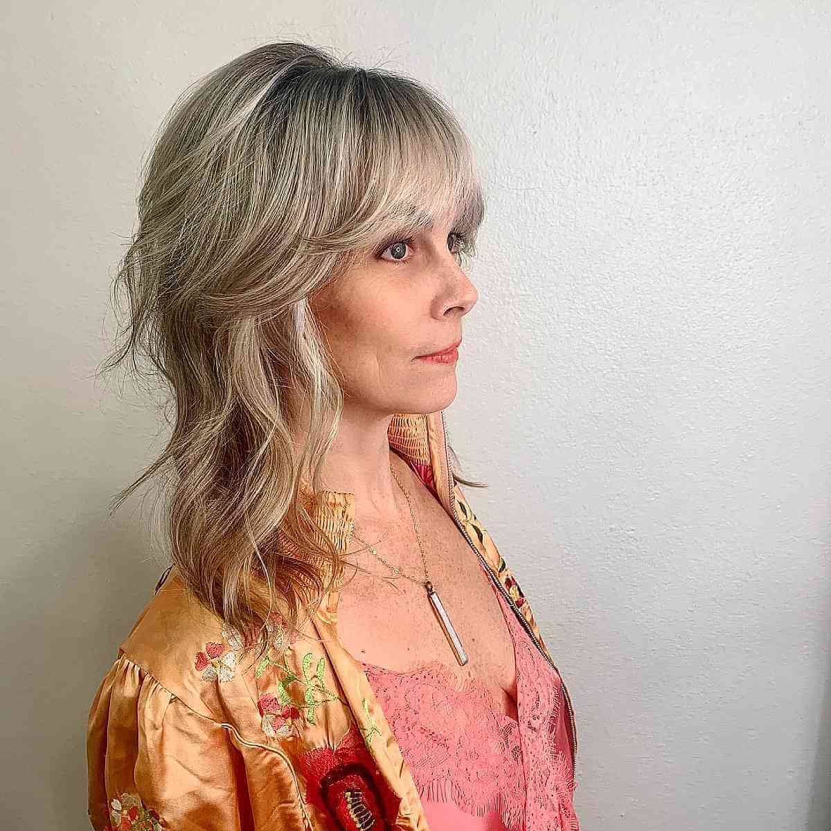 Textured Mid-Length Shag Layers with Soft Bangs for Women Over 40
