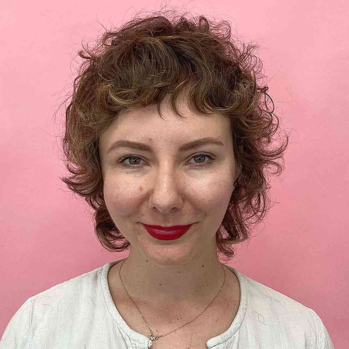 Short Textured Mullet Shag with Curly Bangs on Wavy Hair