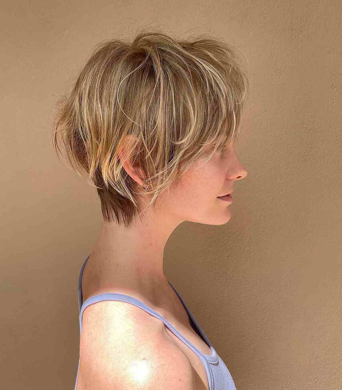 Textured Pixie Bob with Light Layers That is Cut Above the Shoulders