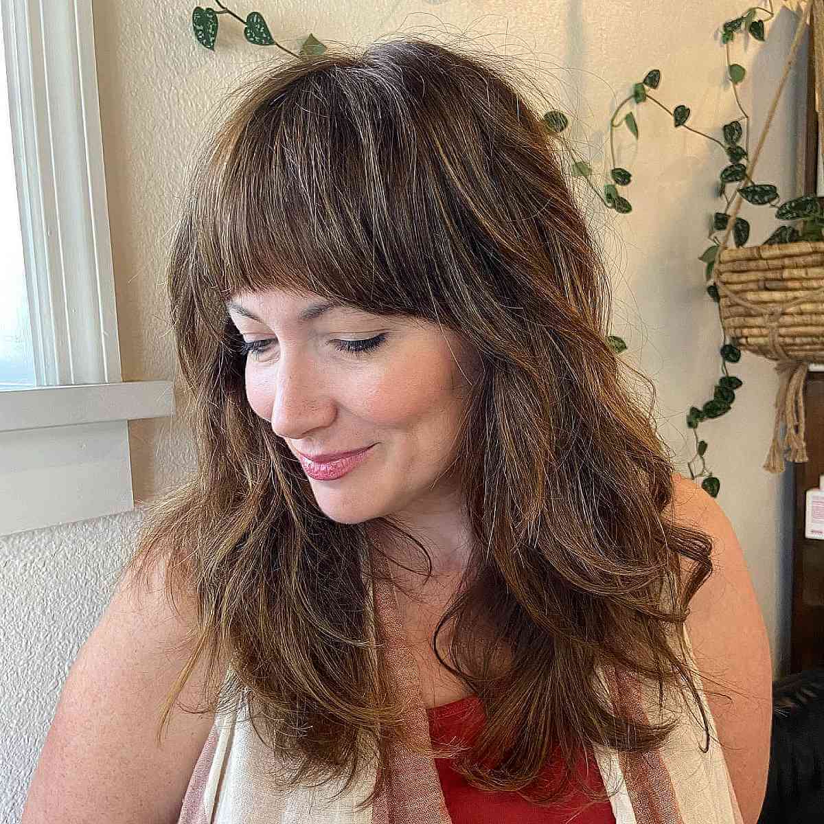 Textured Shag Haircut with Complete Bangs for Women Over Forty