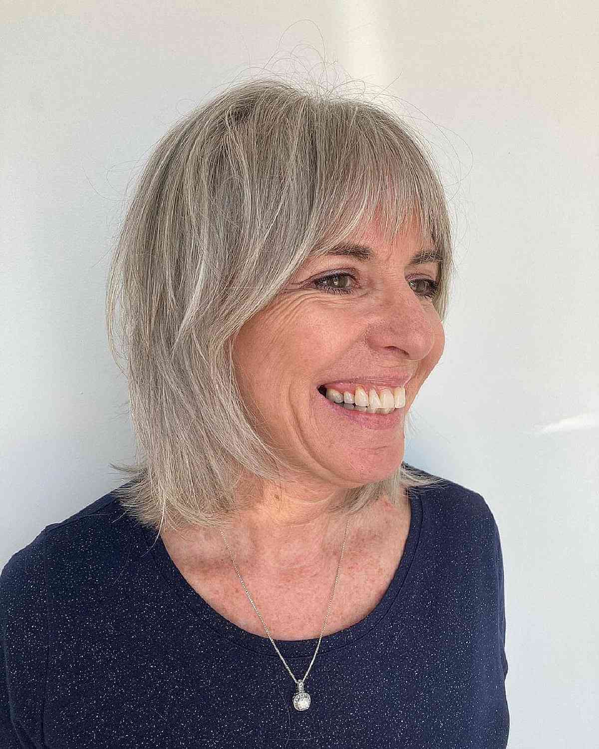 Textured Shag with Curtain Bangs for Sleek Hair