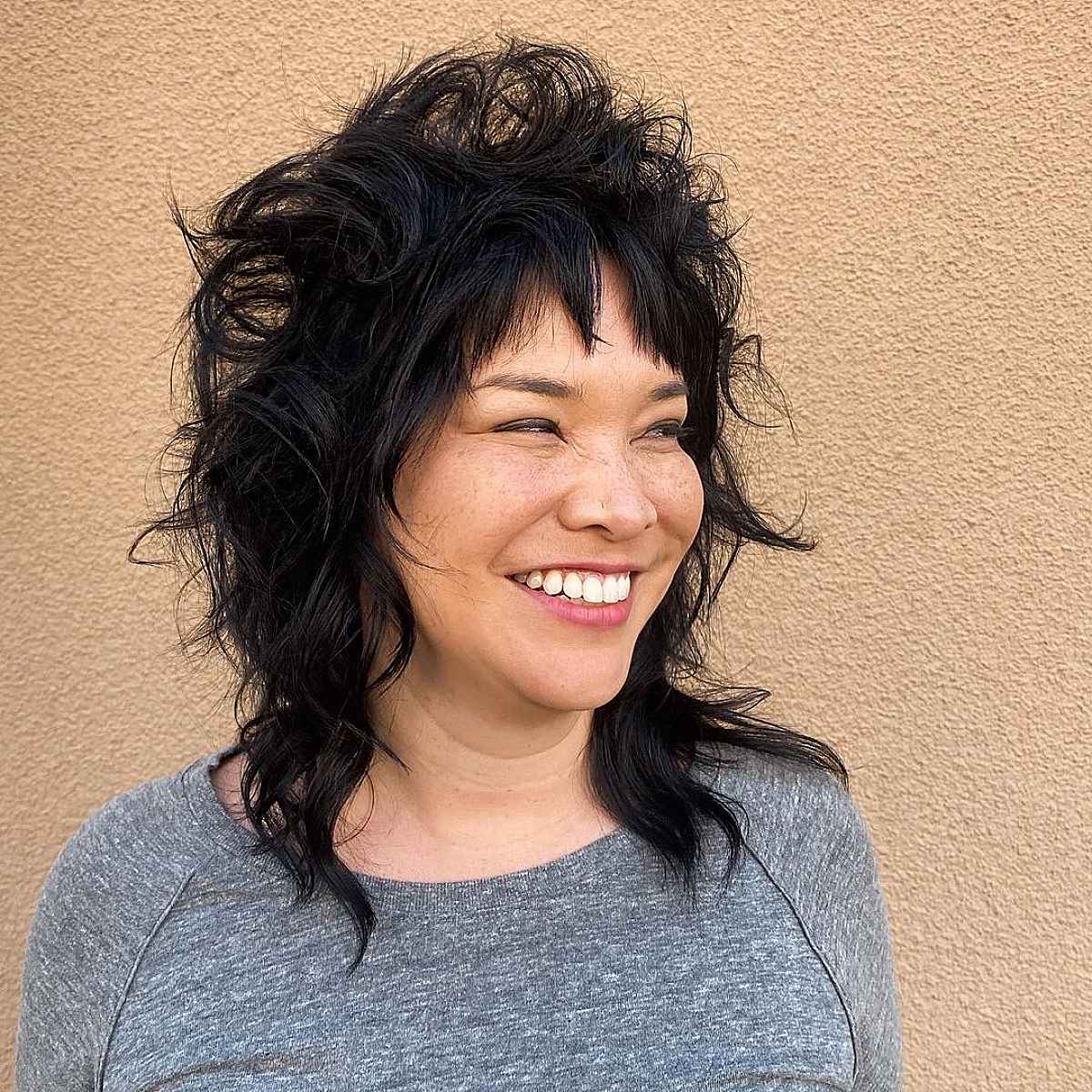 Textured Short Layers on a Mid-Length Wolf Cut