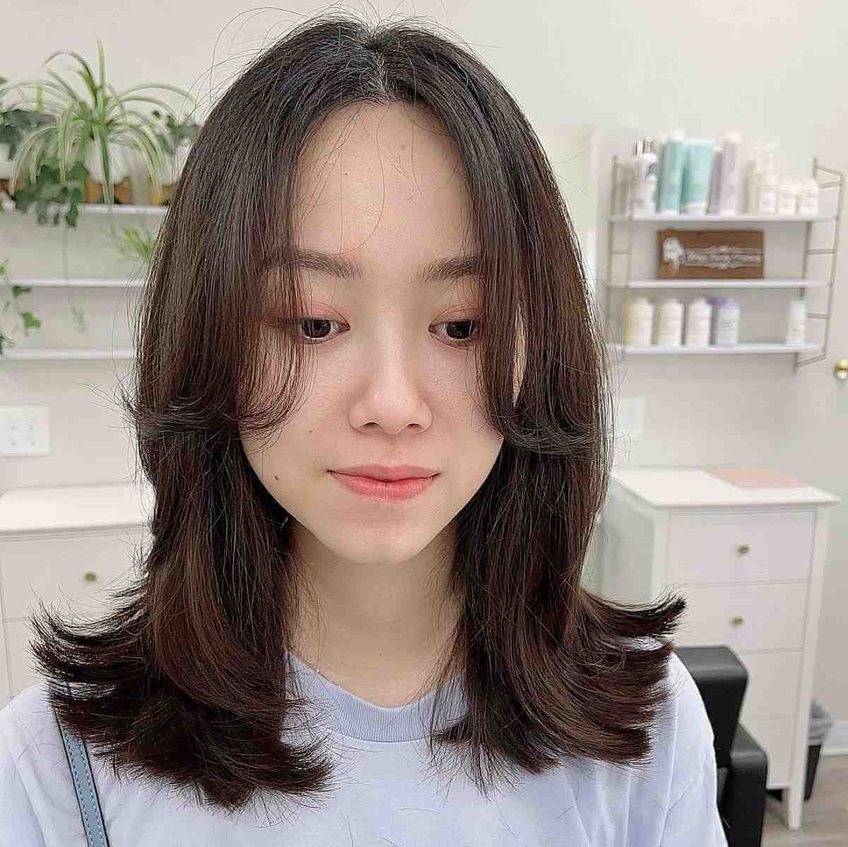 Textured Shoulder-Length Straight Cut with Long Curtain Bangs