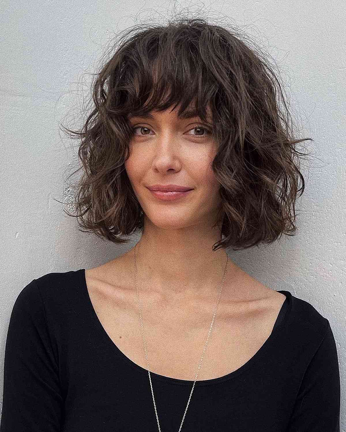 Textured Waves and Bangs for Voluminous Hair