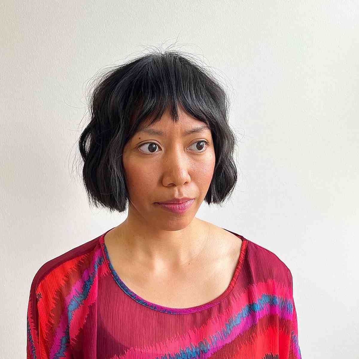 Textured Wavy Chin-Length Bob Hairstyle with a Fringe