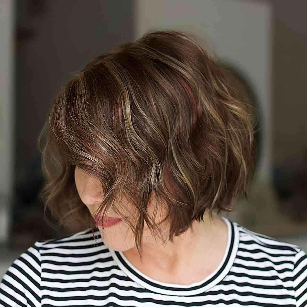 Chin-Grazing Wavy Bob with Blonde and Copper Tones for Thick Hair