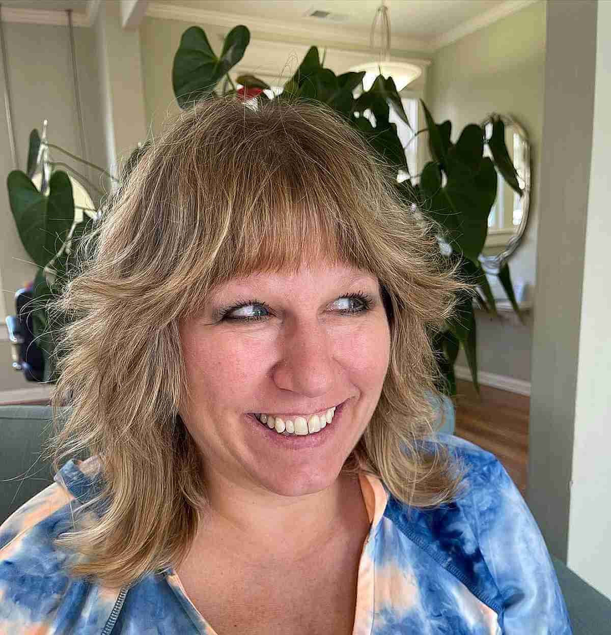 Textured Wolf Cut Featuring Blunt Bangs for Women 40 and Over