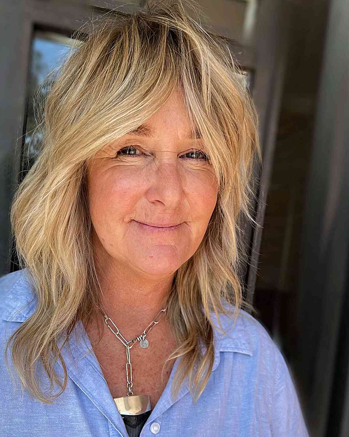 Mid-Length Timeless Soft Shag for Women Over 50 with blonde hair