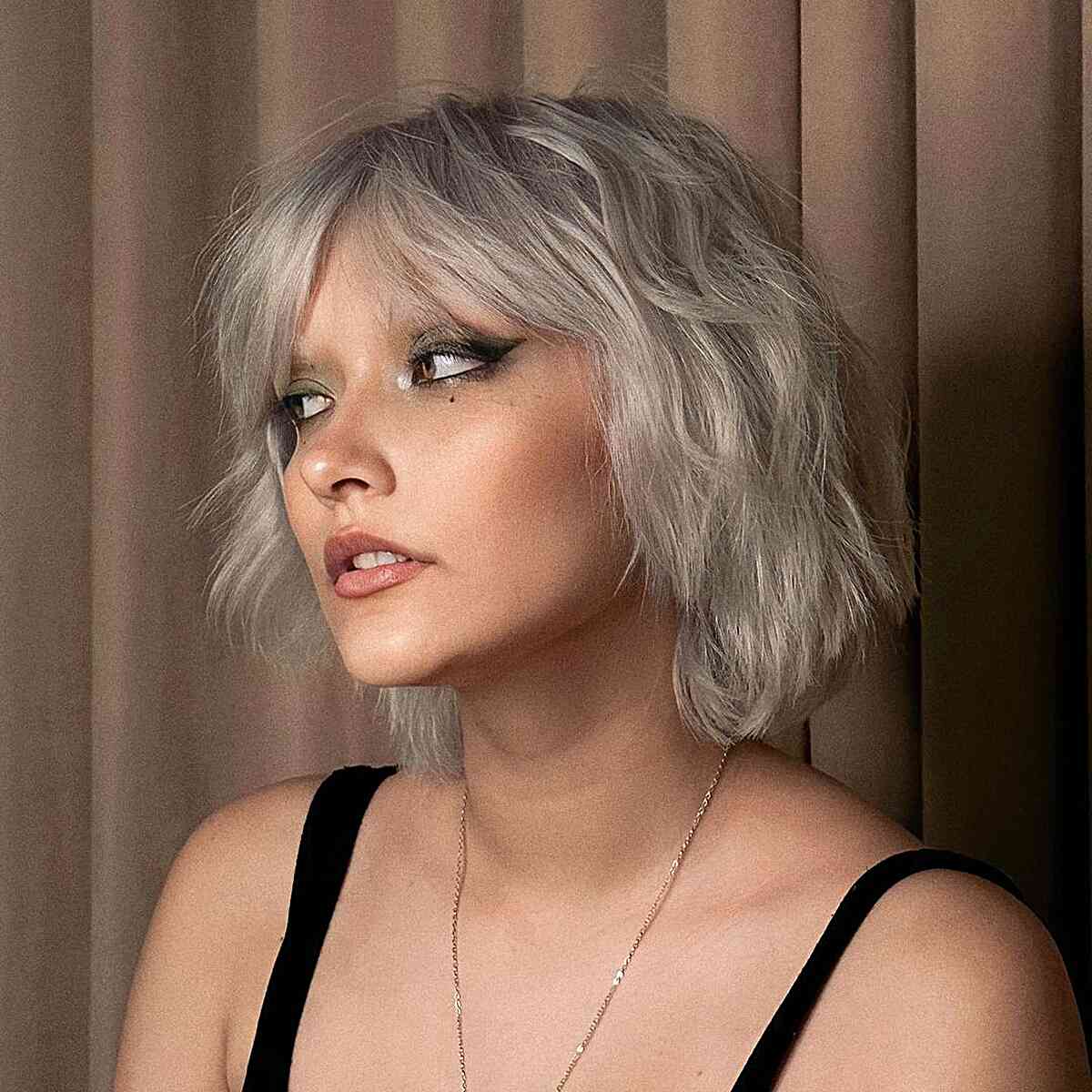 Curtain Fringe on Short Ashy Blonde Tousled Bob