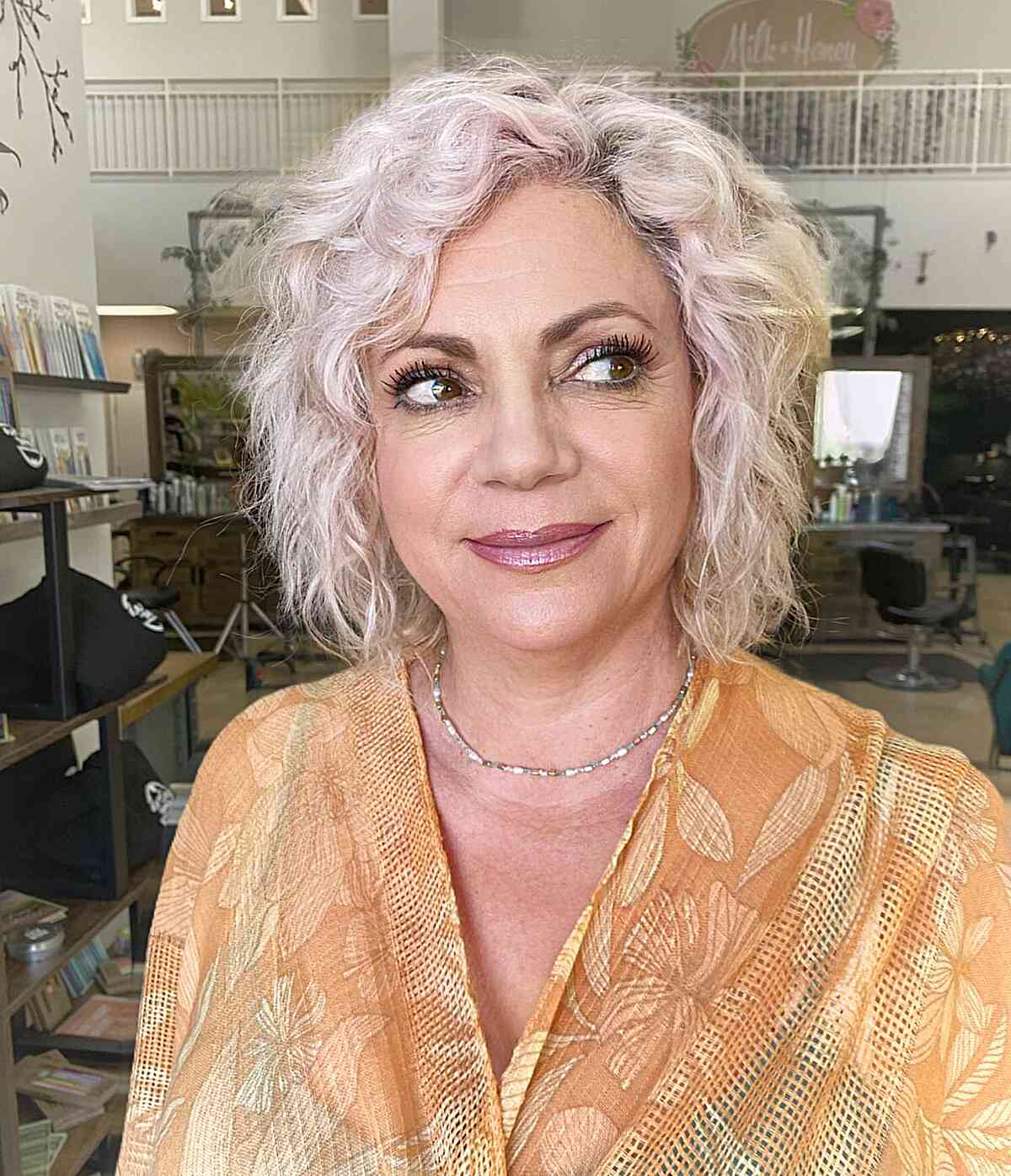 Triangular Short Bob for Women Over 50 with messy, tousled hair