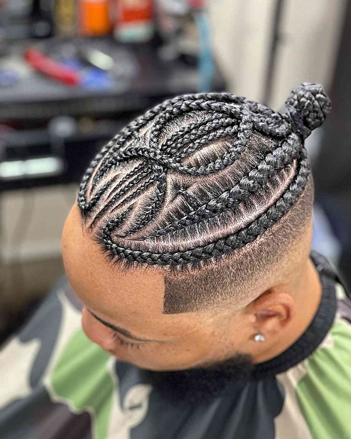 Two-Tone Braided Man Bun with Mid-Bald Fade