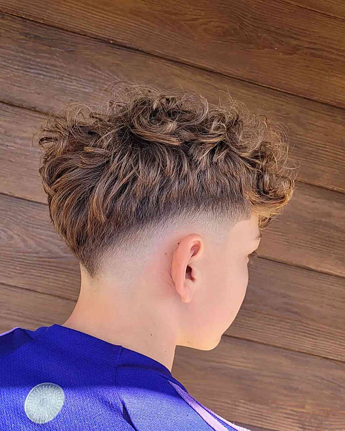Stylish V-Shaped Drop Fade for Boys with Thick Hair