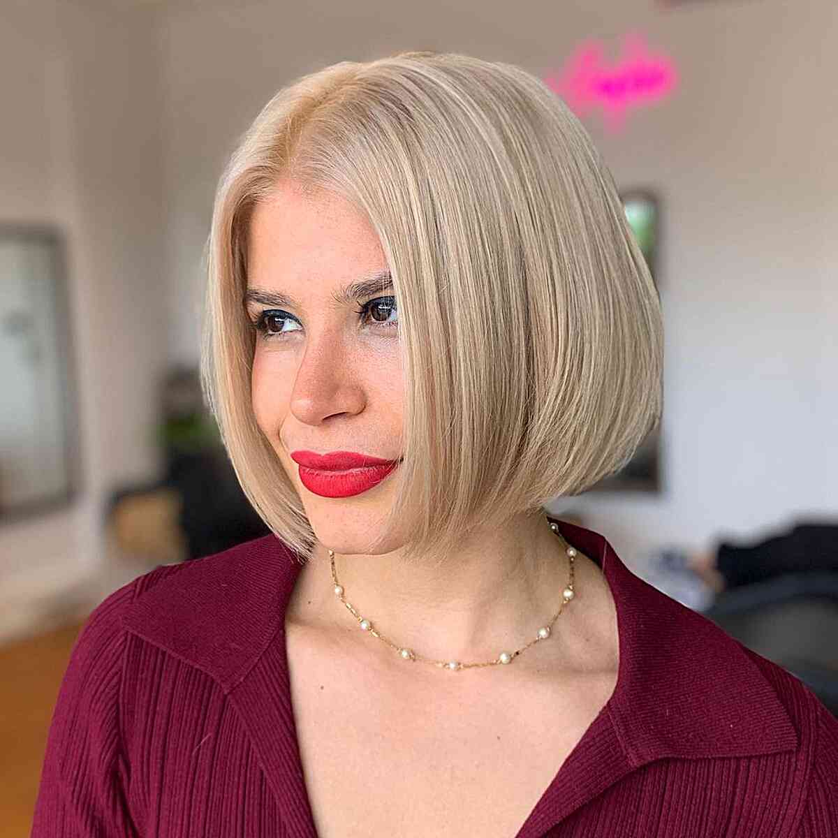 Vanilla Cream Sleek Slob Blonde Haircut for women in their 30s