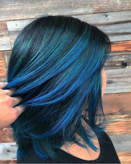 vibrant blue accents on black hair