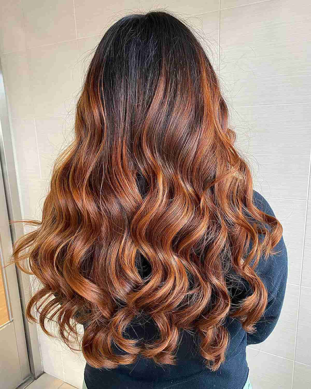 Vibrant Copper Balayage on Dark Locks