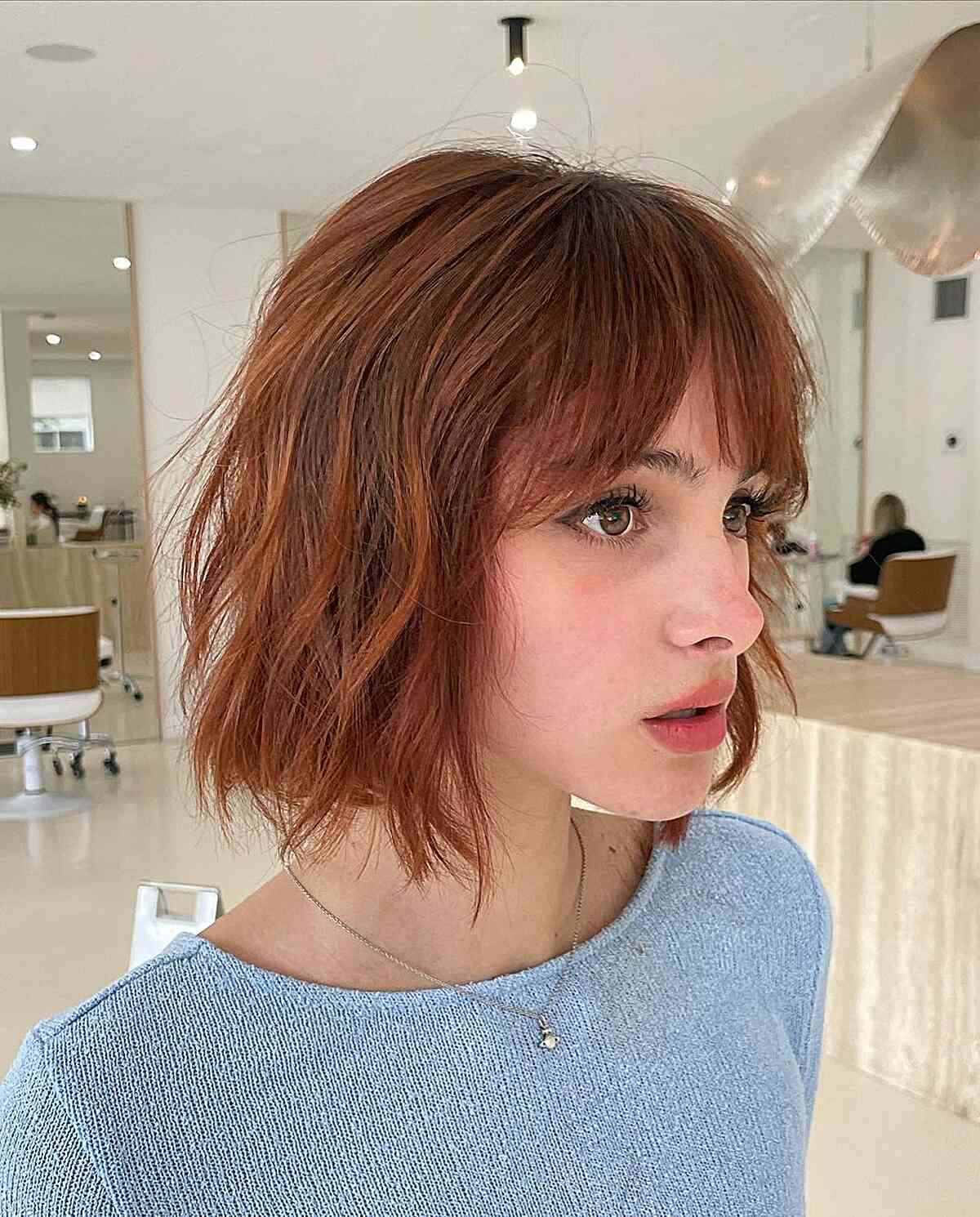 Vibrant Electric Bronze Choppy Bob for women with short messy hair and fringe