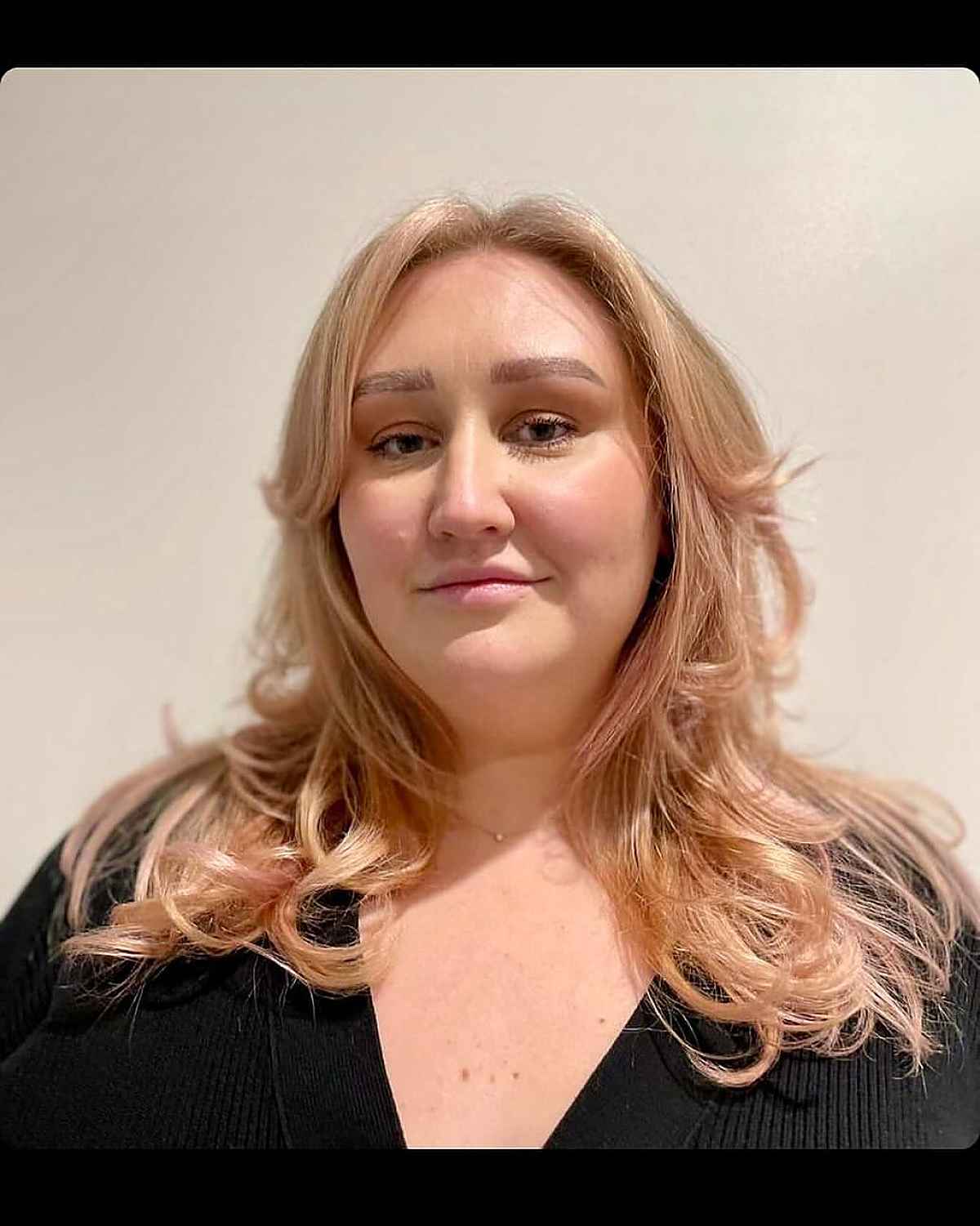 Vibrant Layered Haircut with Extended Curtain Bangs