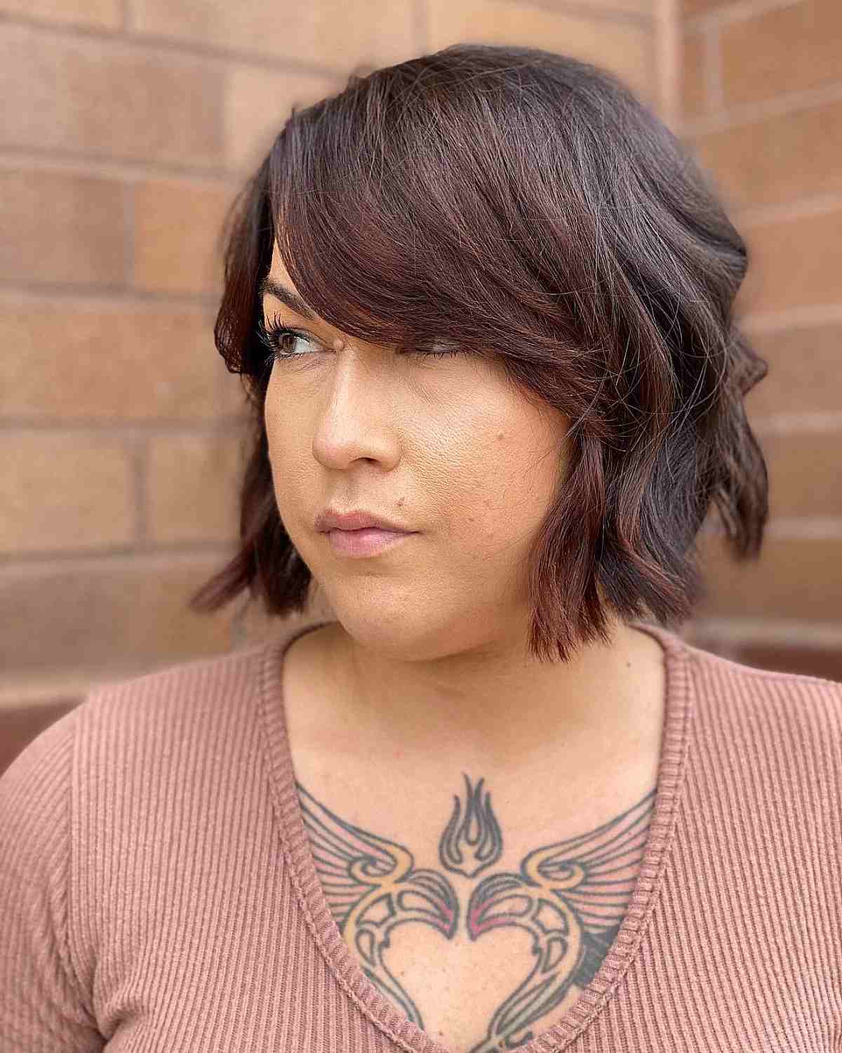 Chin-Length Magenta Wavy Bob with Side Bangs