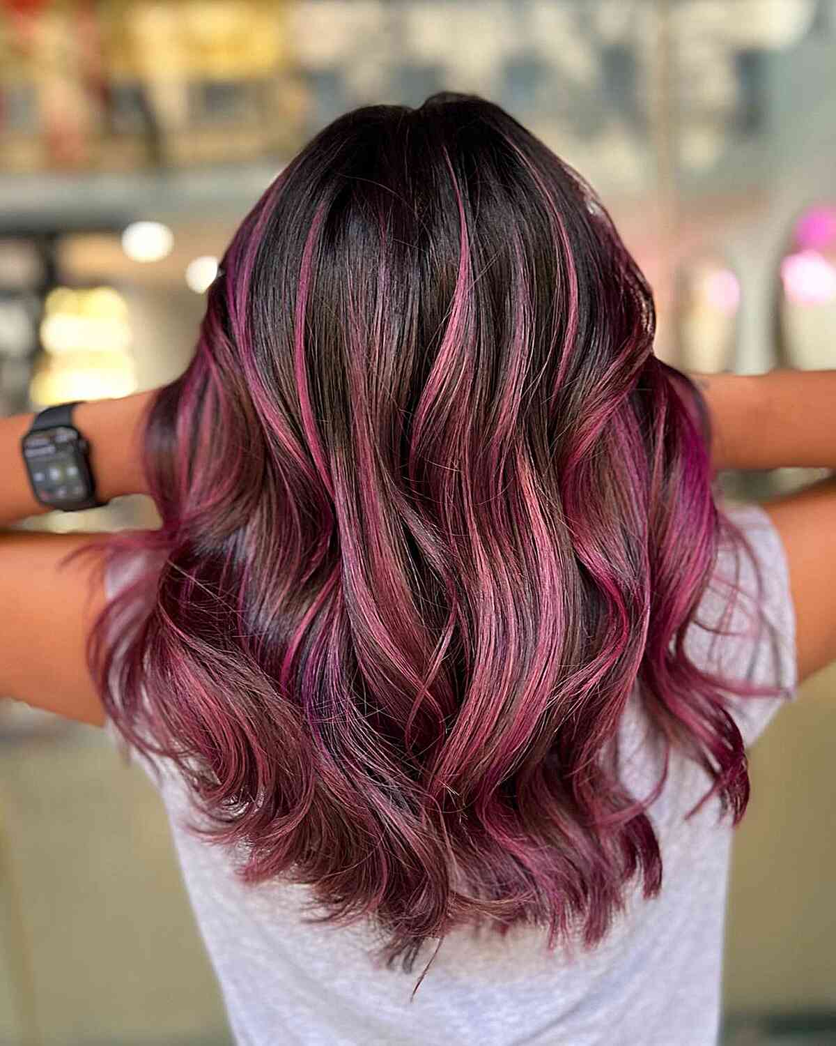 Vibrant Magenta Highlights on Dark Tresses for Women