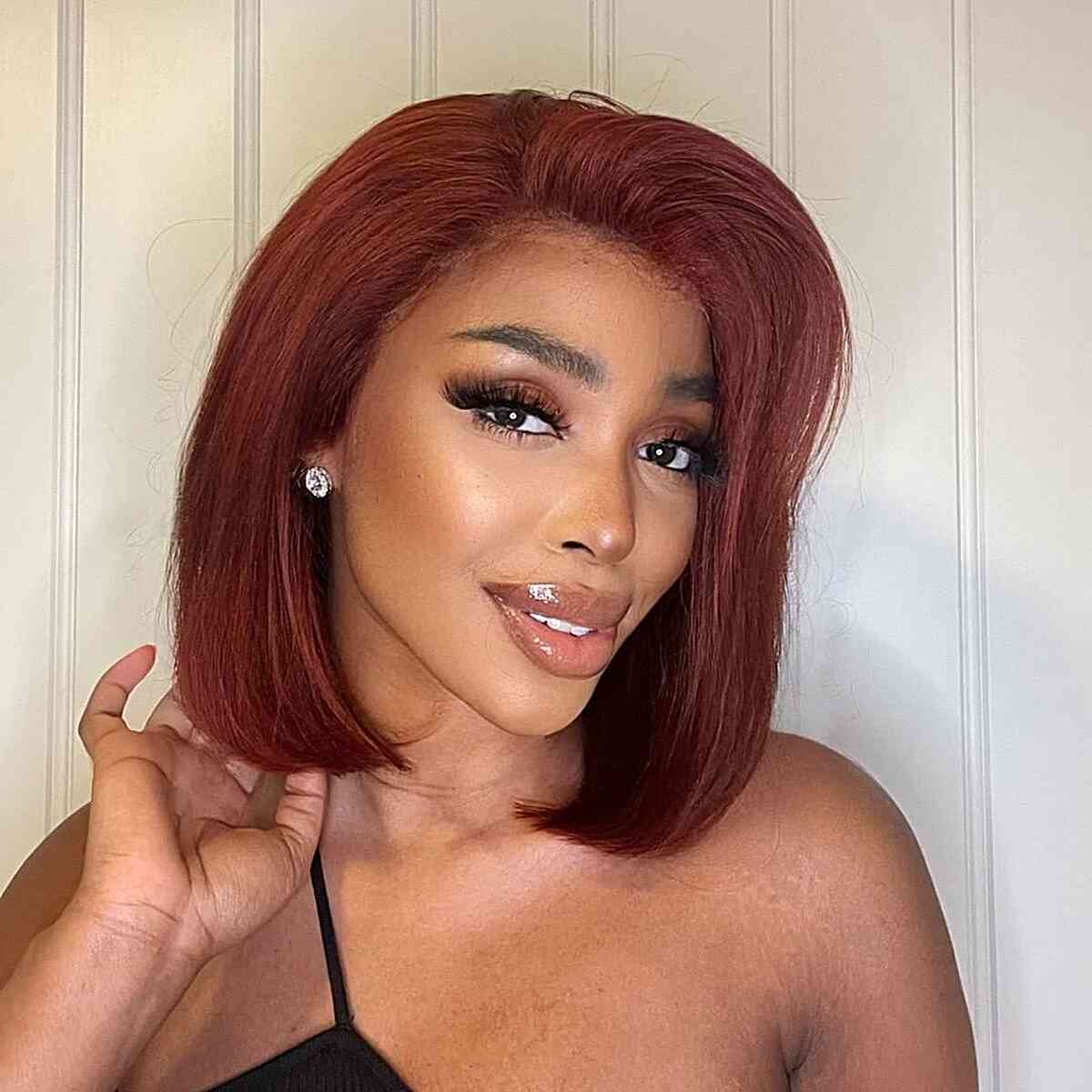 Vibrant shoulder length hairstyle in magenta for black women