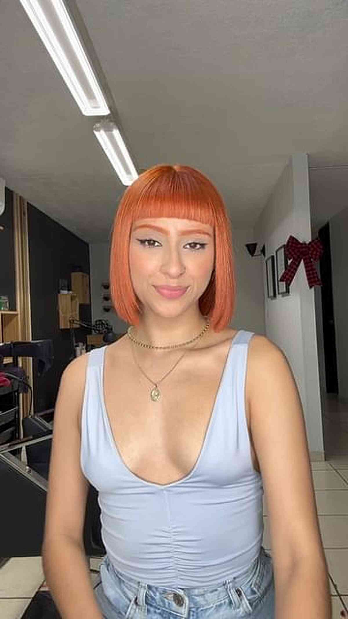 Vibrant Orange-Toned Neck-Length Blunt Bob