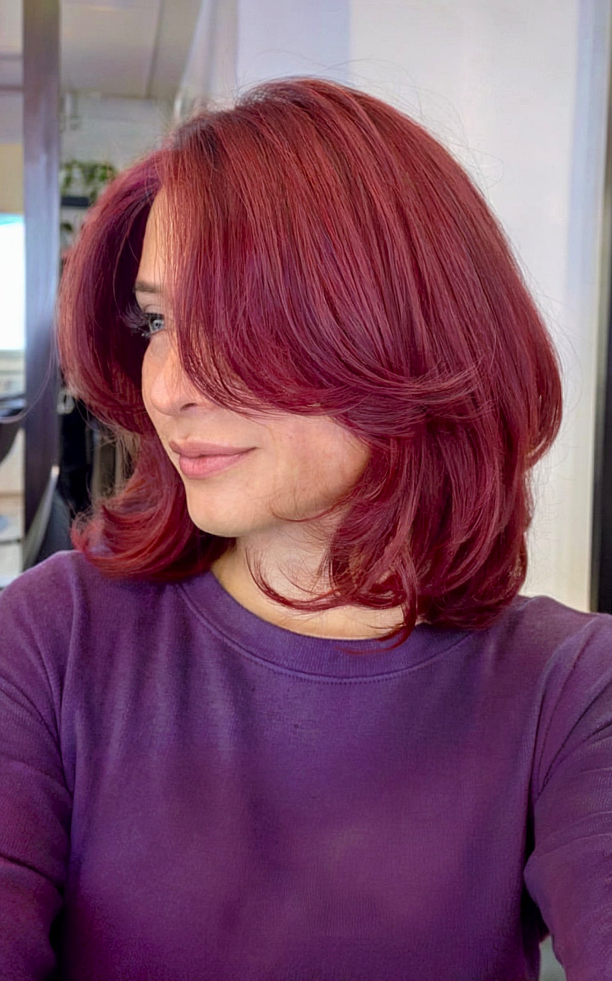 Vibrant Red Long Bouncy Bob with Feathered Layers and Framing Bangs