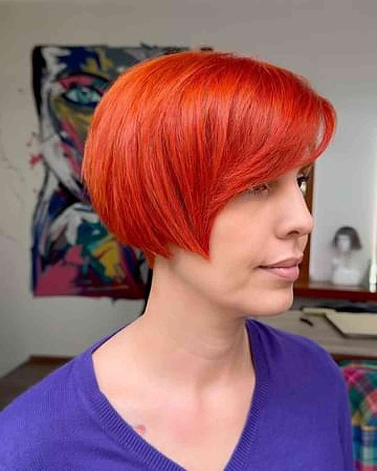 Vibrant Red-Orange Ear-Length Bob for Straight Hair