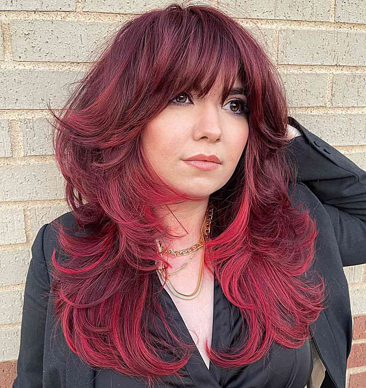 Vibrant Red Long Shag with Layers and Bangs for Rounder Face Shapes and Medium-Length Hair