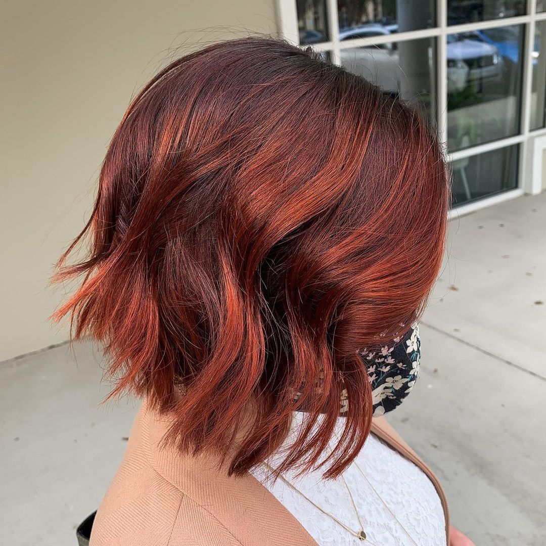 Vivid red accents on short hair