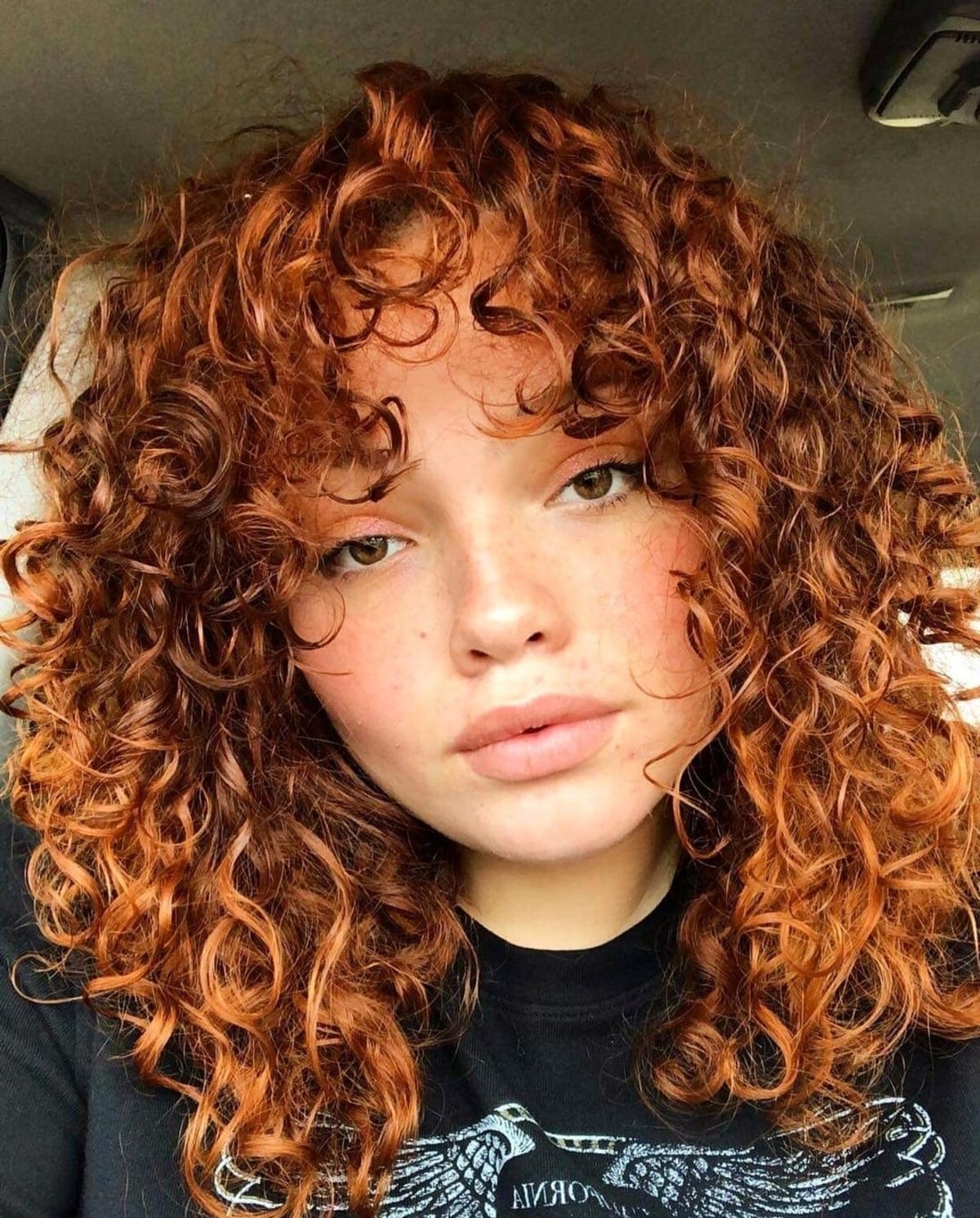 Warm copper curls for mid length hair and square face