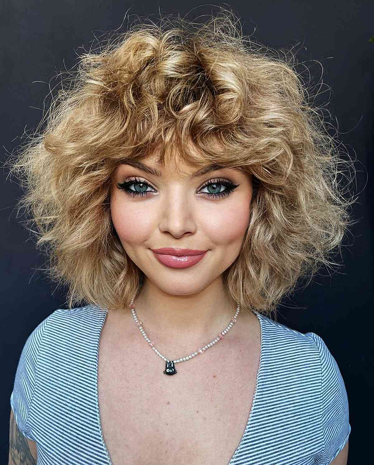 Warm Honey Blonde Curly Long Bob for Oval Face Shapes