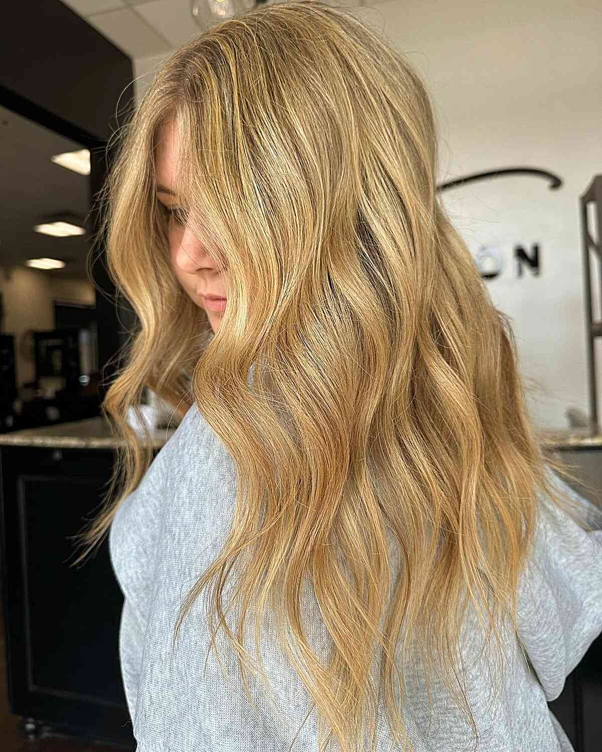 Warm Honey Light Blonde Highlights on Long Wavy Hair