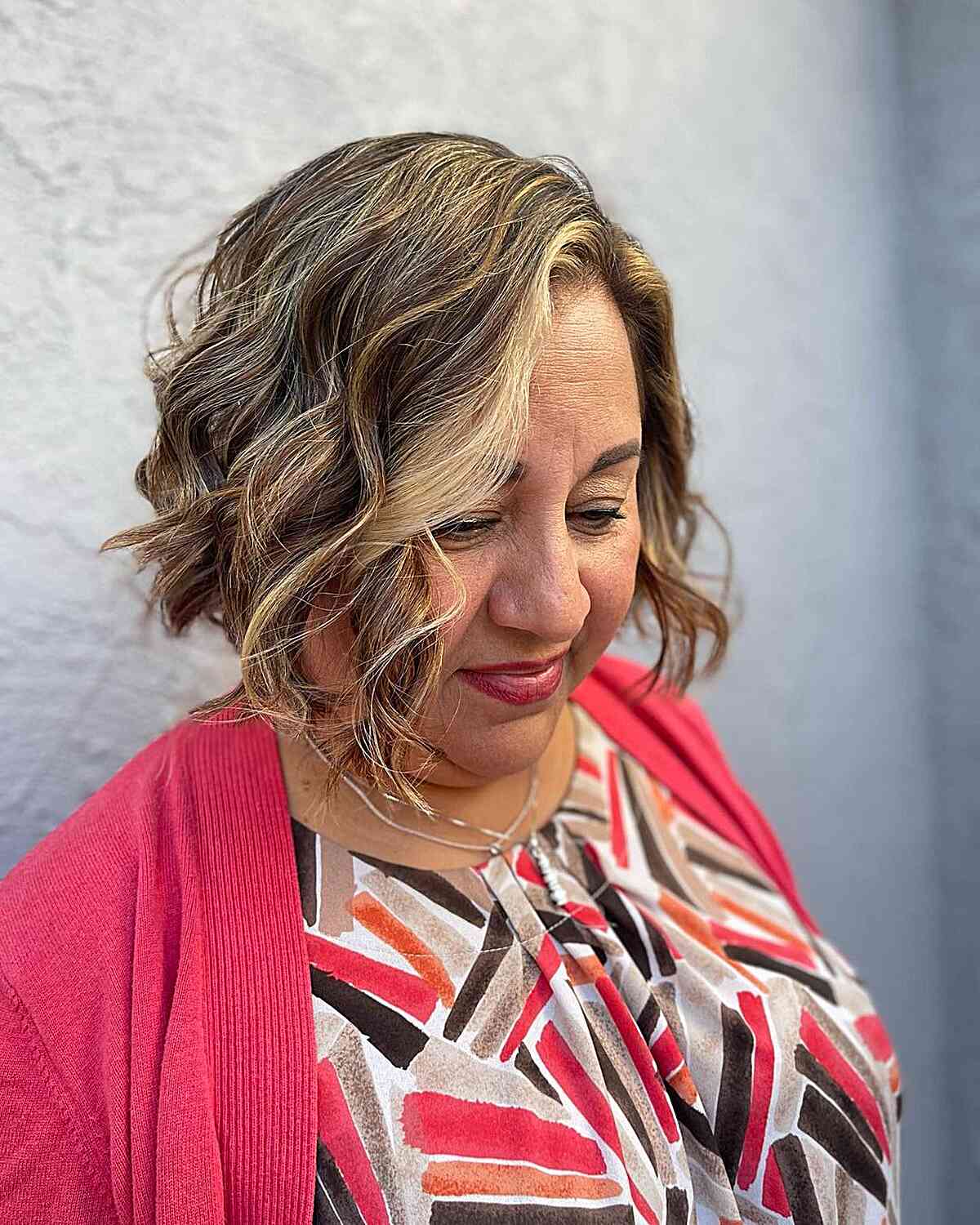 Chin-Length Side-Parted Wavy Bob Style for Women Over 60 with Round-Shaped Faces