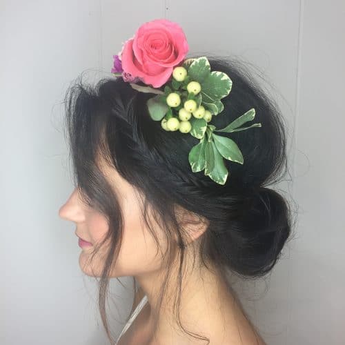 Whimsical Side Braid Updo Adorned with Blooms