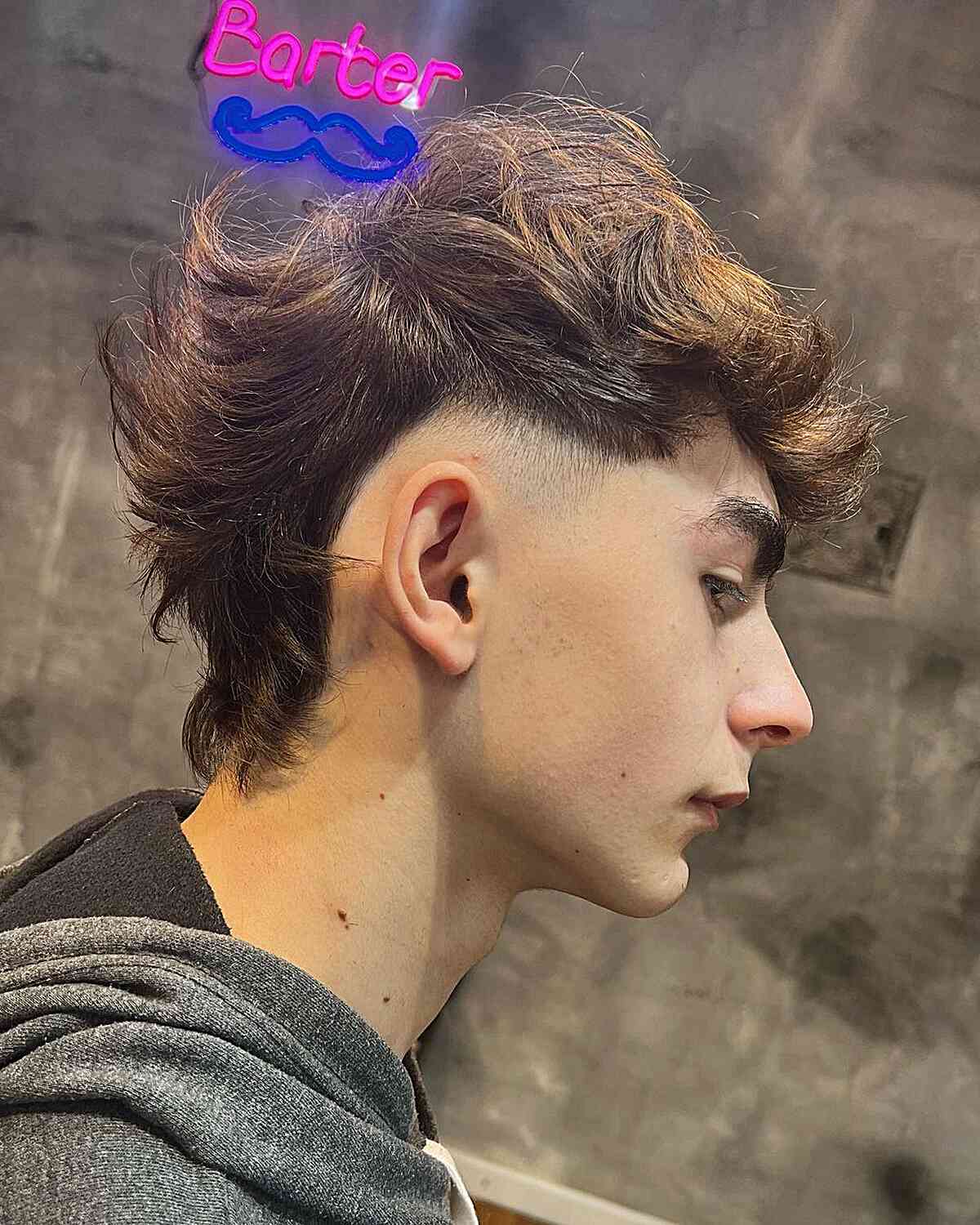 Mullet Fade with Textured Top for Young Men