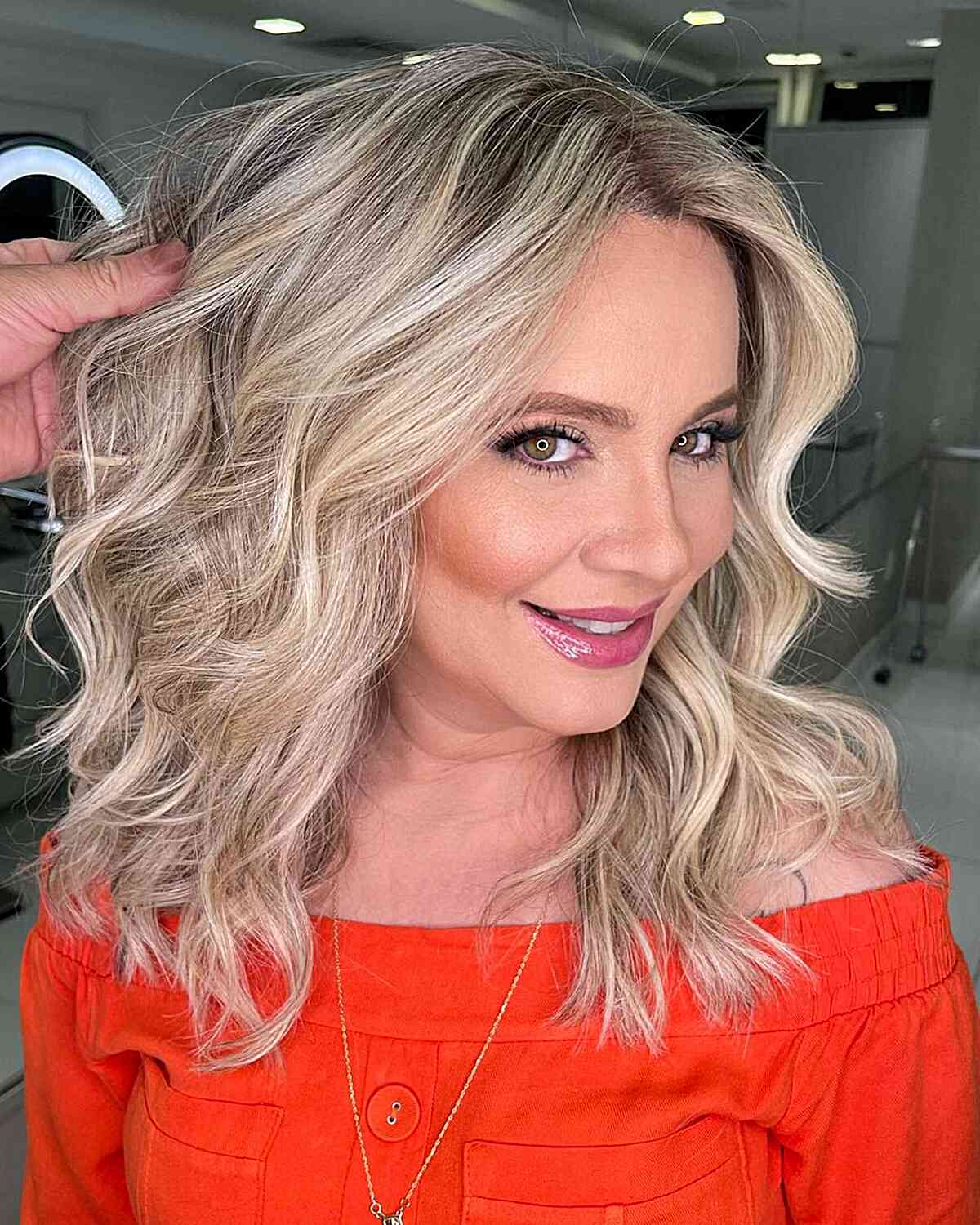Multi-Dimensional Blonde Balayage for women with mid-length hair